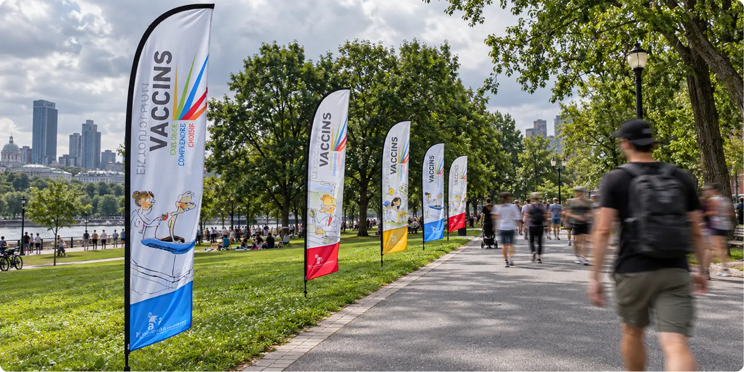 Rectangle 13117 White teardrop flags for a vaccination event in a park – Pinecrest Signs, Montreal